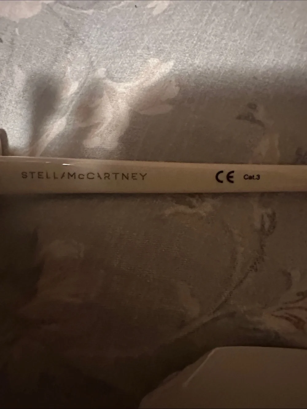Stella McCartney Cream Swan Sunglasses with Black Lenses and Red Beak Accents